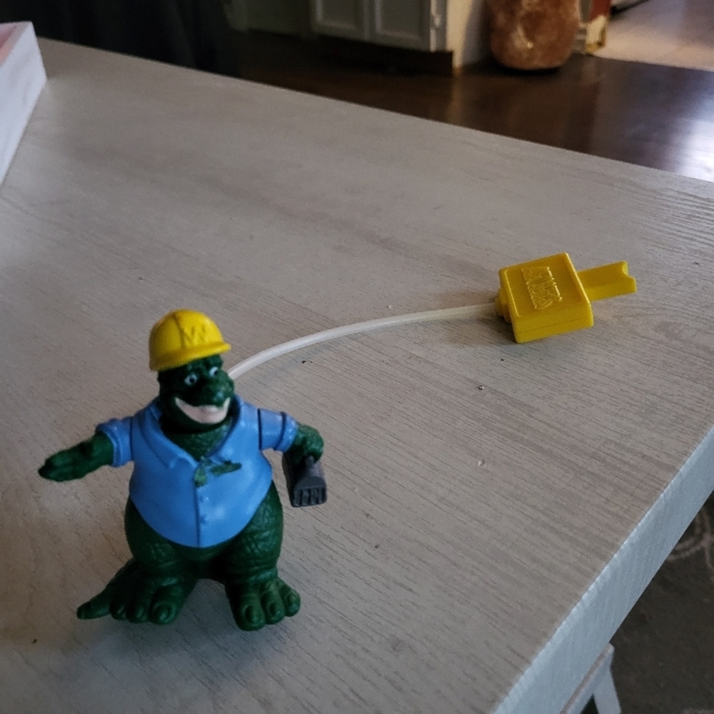 Green Reptile Toy with Yellow Hat